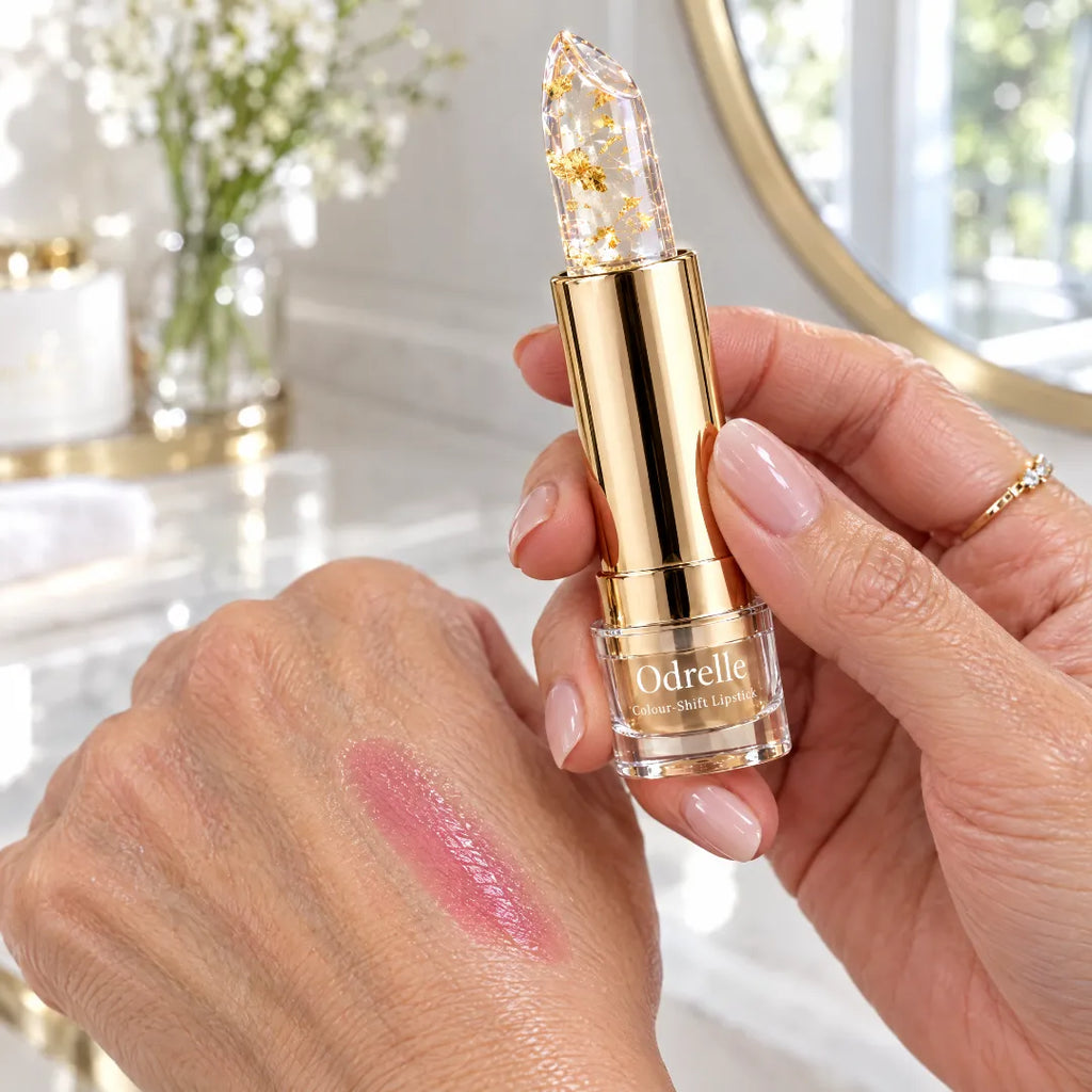 Odrelle gold-flake lipstick with pink swatch on hand